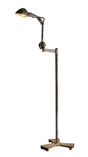 Antique industrial floor lamp in Dubai showroom.